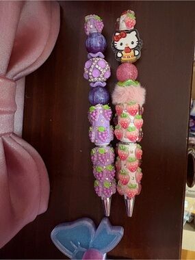 Hello Kitty strawberry pen & grape pen